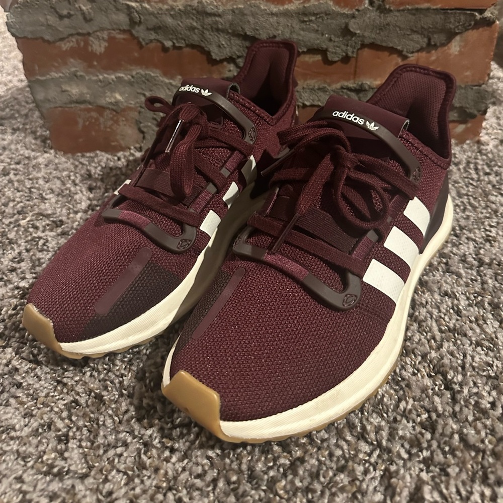Burgundy Adidas running shoes